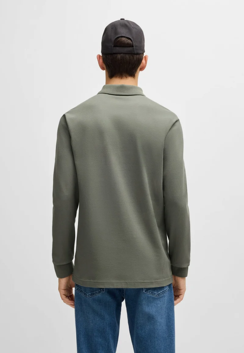 بوس قميص بولو بقصة ضيقة من قطن البيكيه المطاطي